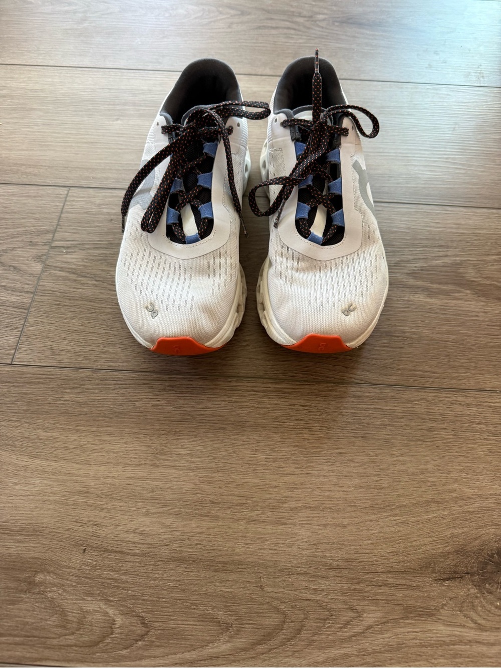 On Running Women's White Sneakers with Orange Toe and Navy Accents